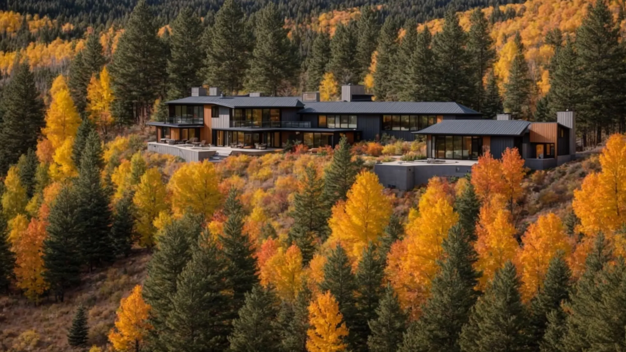 a panoramic view of a modern home in conifer, co, displays vibrant autumn foliage against a clear blue sky, symbolizing the seamless blend of technology and nature in the evolving housing market.