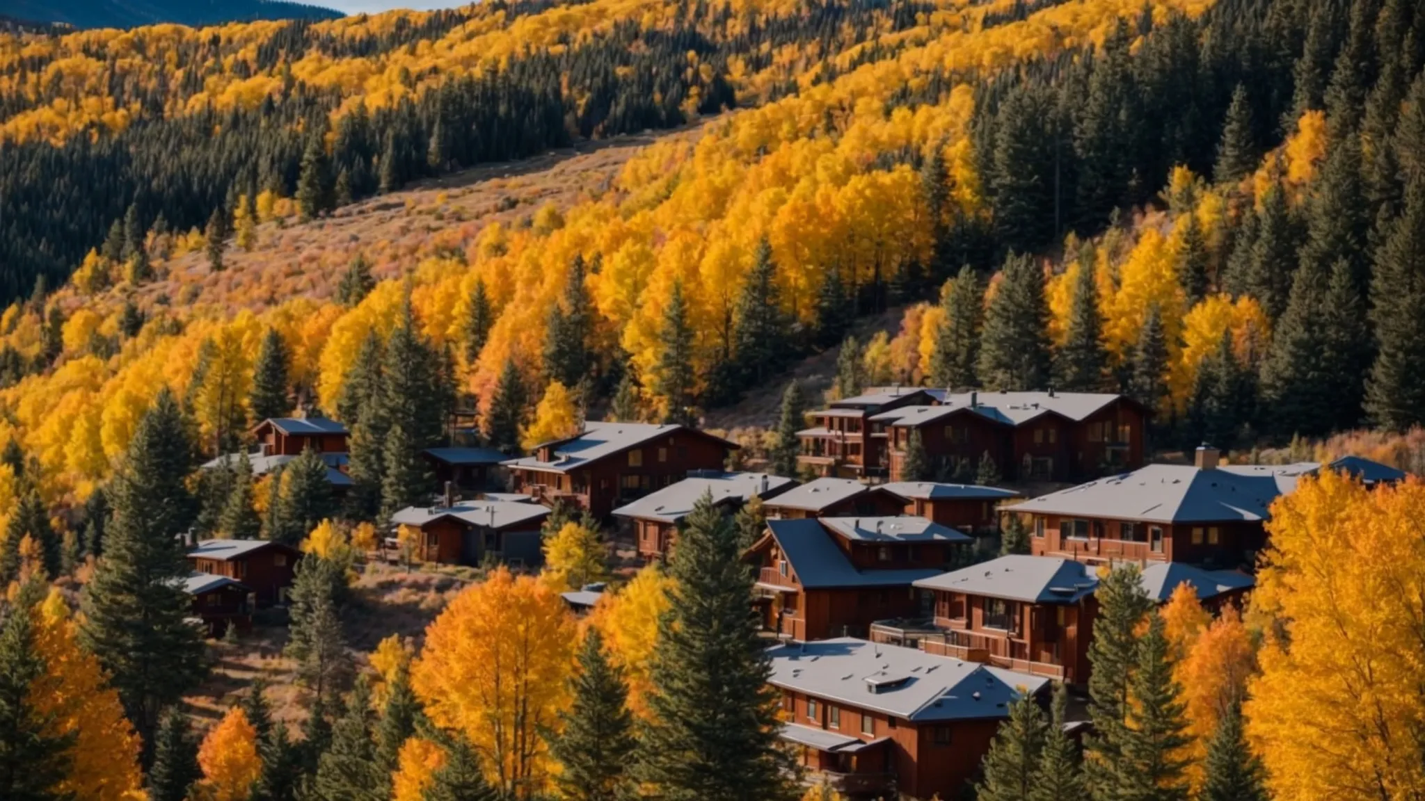 a picturesque view of conifer, co, showcasing vibrant seasonal landscapes contrasting colorful autumn foliage with cozy homes, reflecting the dynamic fluctuations of the local real estate market beneath a clear blue sky.