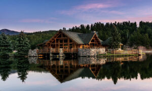 Evergreen Lake surrounded by pine trees and mountain homes in Evergreen, Colorado